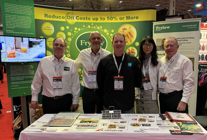 chris-frylow-booth The Frylow Canada team greets guests at a tradeshow booth.