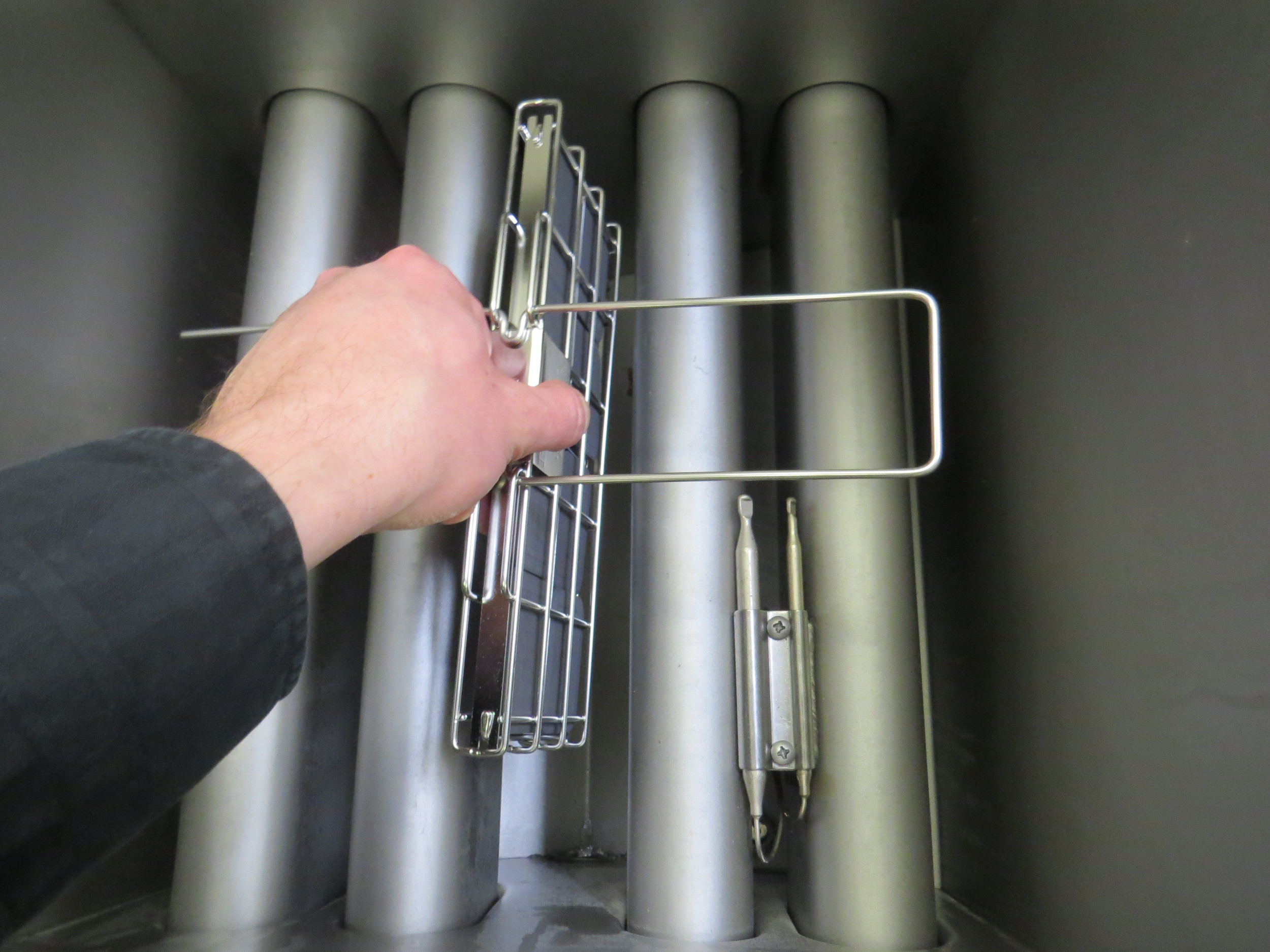 A demonstration of Frylow being put into a commercial deep fryer, saving restaurants on frying oil.